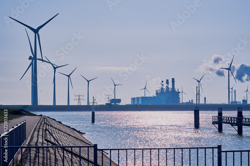 Wind turbine  in the background blue sky and sea