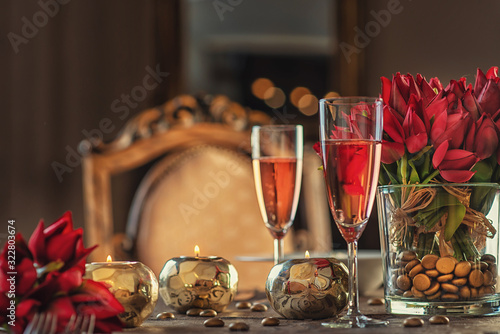 valentines day background with roses, candles and champagne in hotel or restaurant, romantic evening 