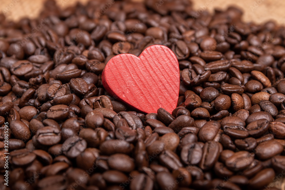 Coffee beans and a wooden heart Coffee beans and a wooden heart