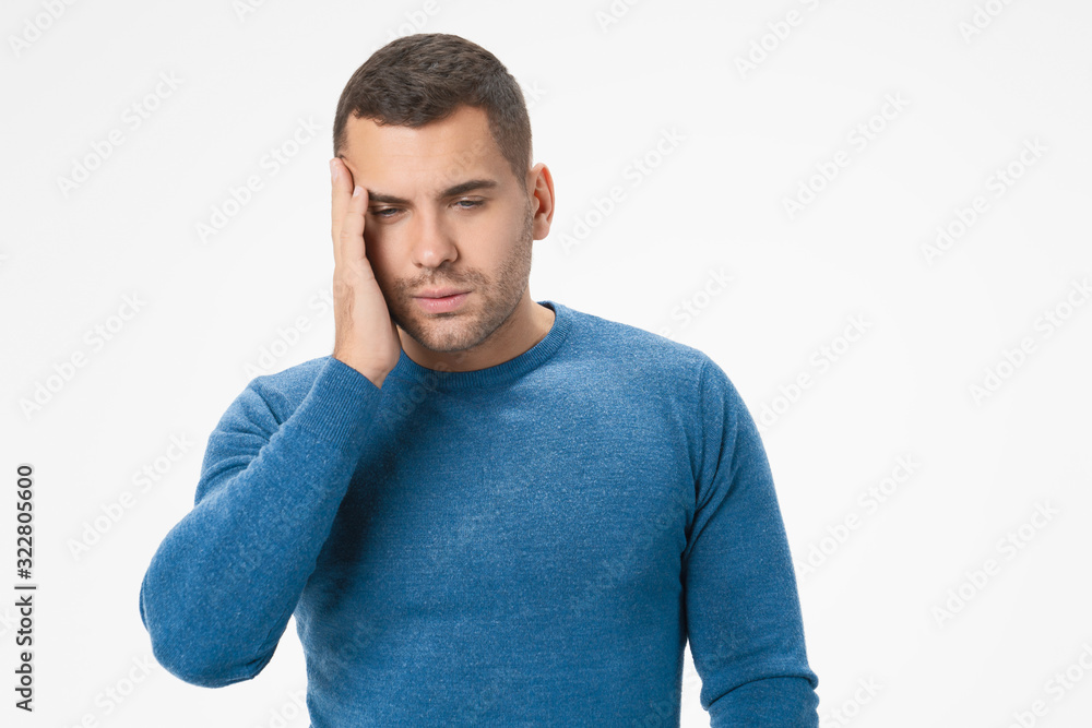 Caucasian unhealthy male suffer from strong headache and tired isolated on white studio background