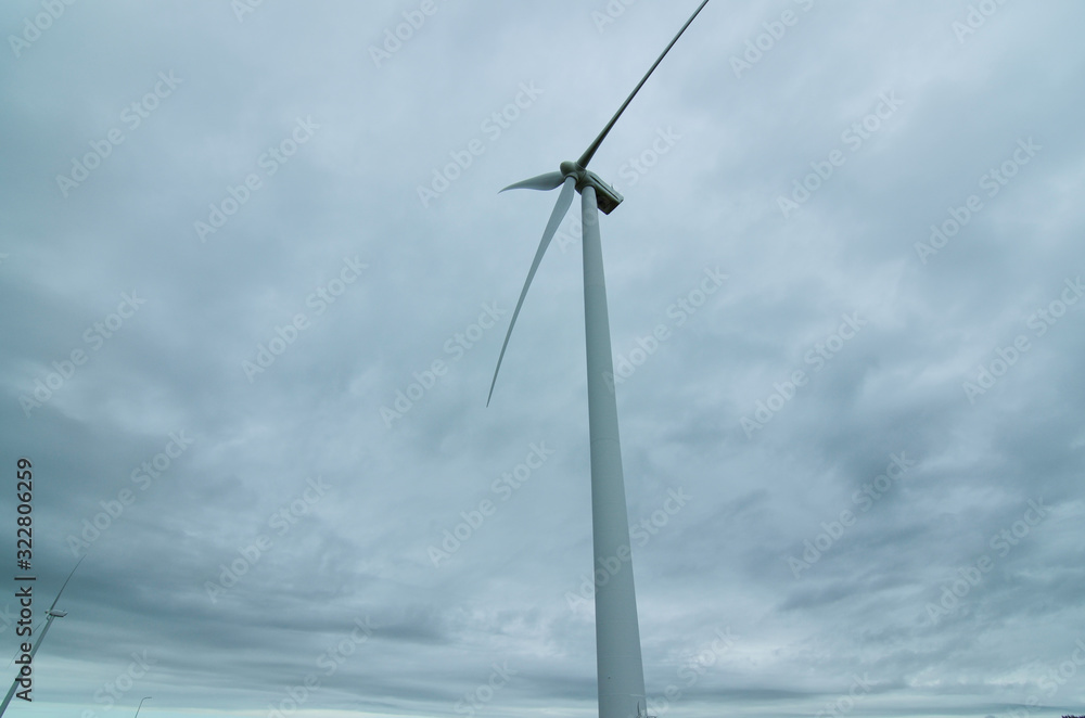 Oosterscheldekering, the netherlands, August 2019. In the Zeeland countryside, wind farms: a particular landscape characterized by wind turbines. Oosterscheldekering, the netherlands, August 2019. In the Zeeland countryside, wind farms: a particular landscape characterized by wind turbines.
