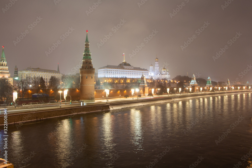 Night view from the Bolshoi Kamenny bridge across the Moscow River to the Moscow Kremlin.