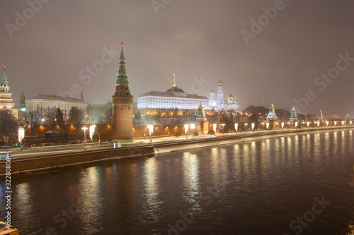 Night view from the Bolshoi Kamenny bridge across the Moscow River to the Moscow Kremlin.