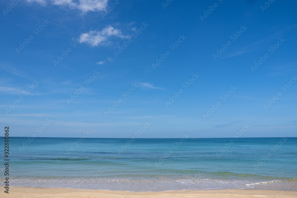 Ocean view and white sand beach with blue sky and a tiny wave background Ocean view and white sand beach with blue sky and a tiny wave background