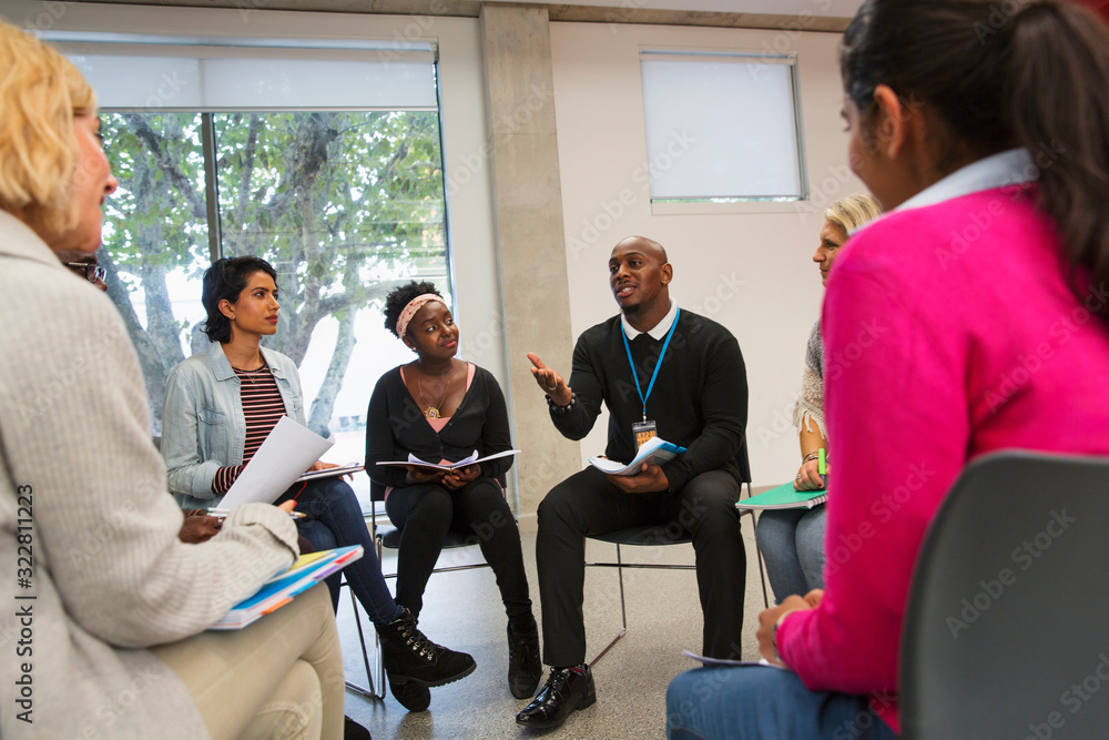 Man talking in support group meeting circle Man talking in support group meeting circle