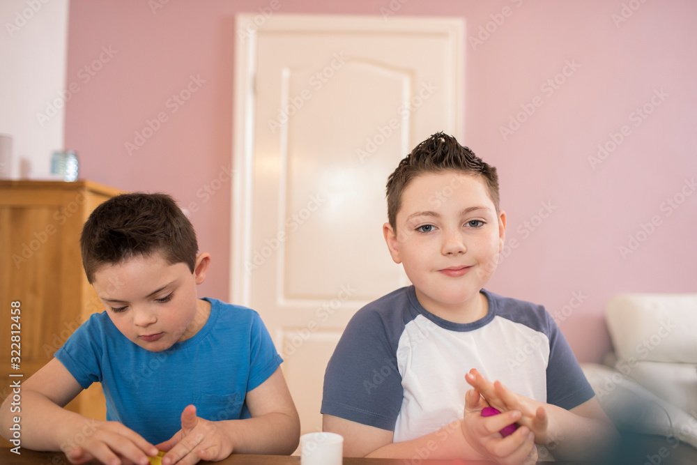 Portrait confident boy playing with brother Portrait confident boy playing with brother