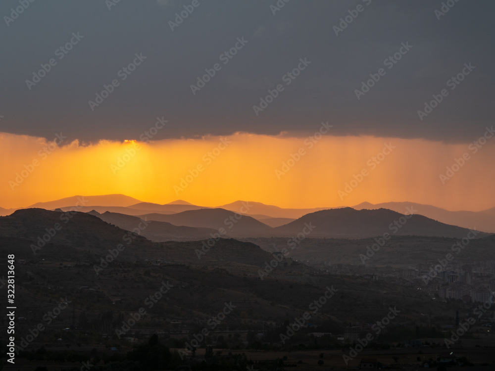 View across Cappadoccia valley from Uchisar Castle during sunset, Turkey