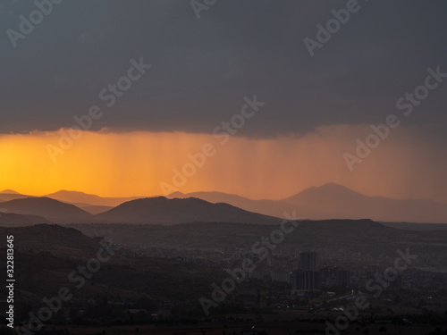 View across Cappadoccia valley from Uchisar Castle during sunset, Turkey