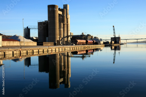 reflections of buildings in water by harbor