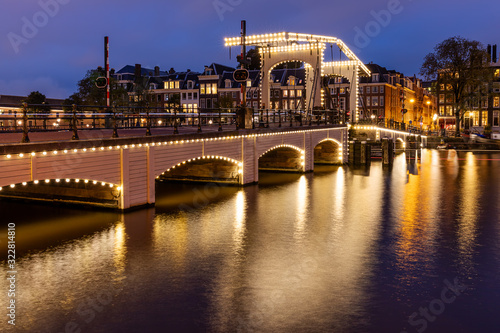Photography Magere Brug (The Skinny Bridge) crossing the river Amstel in Amsterdam, Netherla
