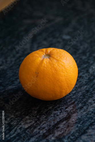 Orange on the dark kitchen marble