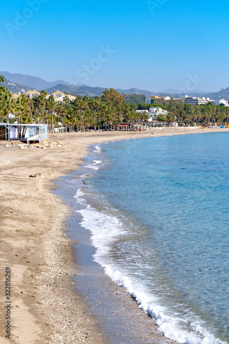 View of the beach in Marbella, the popular sun drenched Spanish turist destination on the country’s east, Costal del Sol coast along Mediterranean.
