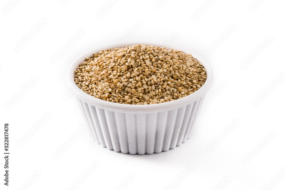 Golden flax seeds in white bow isolated on white background Golden flax seeds in white bow isolated on white background