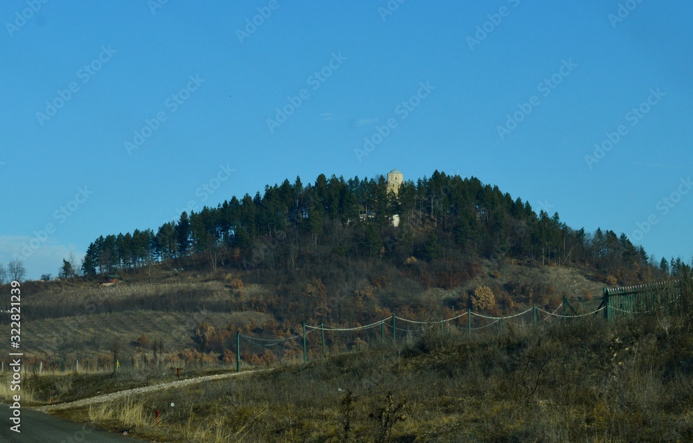 a Christian monastery at the top of a hill