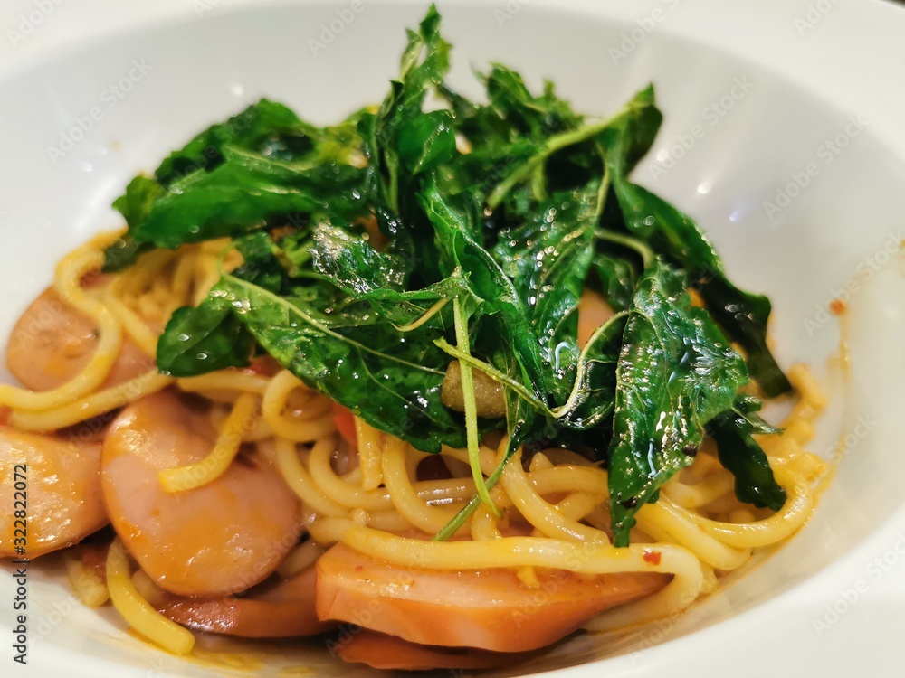 the Asian Thai Italian spaghetti with spicy sausage sauce in the plae tin the restaurant the Asian Thai Italian spaghetti with spicy sausage sauce in the plae tin the restaurant
