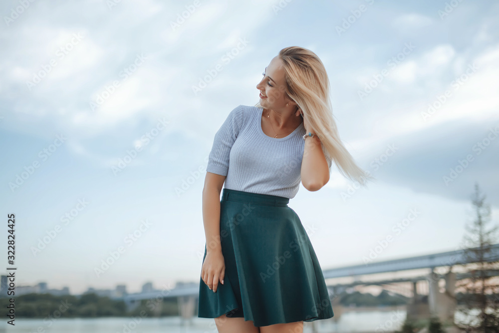 Elegant stylish woman wearing mini skirt, posing with amazing blue sky. Elegant stylish woman wearing mini skirt, posing with amazing blue sky.