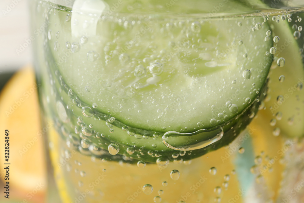 Glass with fresh infused cucumber water, close up Glass with fresh infused cucumber water, close up
