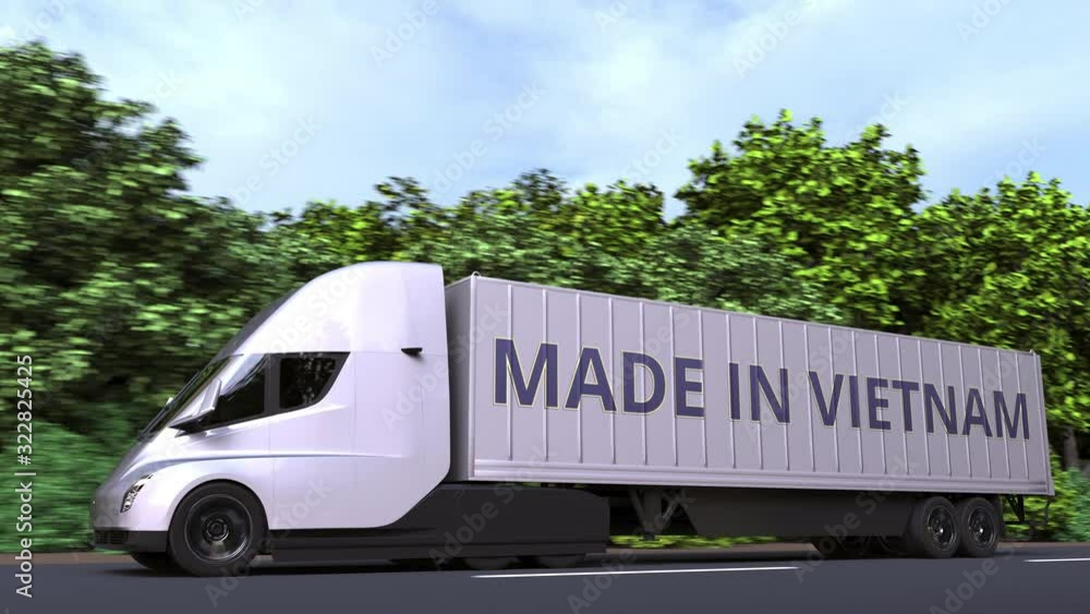 Modern electric semi-trailer truck with MADE IN VIETNAM text on the side. Vietnamese import or export related loopable 3D animation Modern electric semi-trailer truck with MADE IN VIETNAM text on the side. Vietnamese import or export related loopable 3D animation