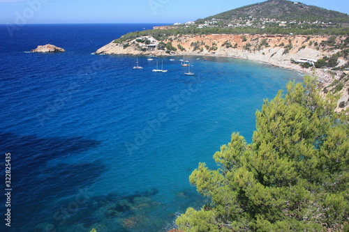 the coast of Ibiza in the Mediterranean sea on a beautiful sunny summer day photo