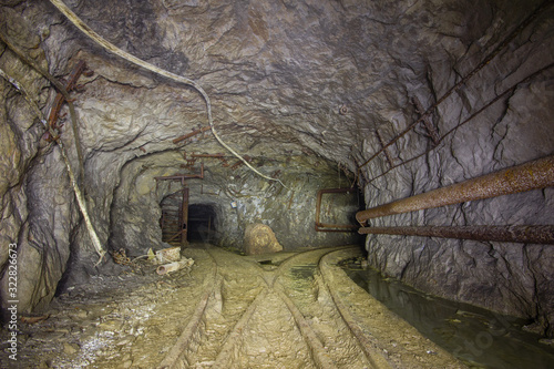 Copper mine underground tunnel with rails two ways