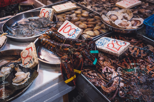 Lobster , crayfish and mussels on seafood market in Hong Kong photo