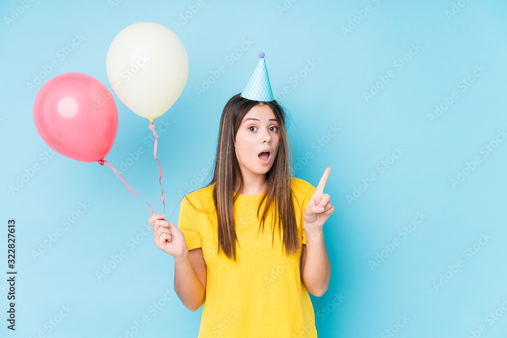 Young caucasian woman organizing a birthday isolated Young caucasian woman organizing a birthday isolated