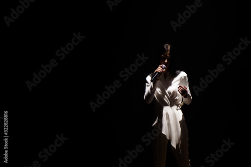 фотографія Artist performing live on scene in music hall