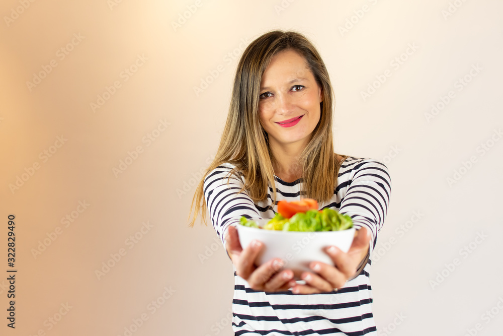 Woman with a salad in her hands Woman with a salad in her hands