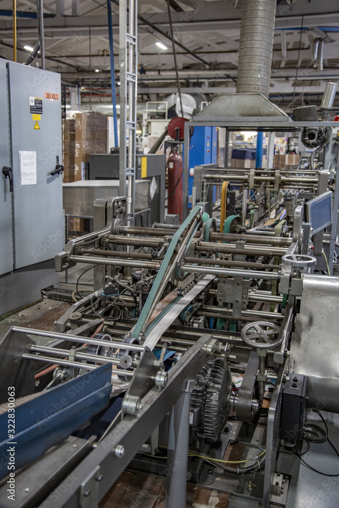 Industrial workshop of the Lambumiz plant. Production of laminated cardboard food packaging. Moscow, Russia