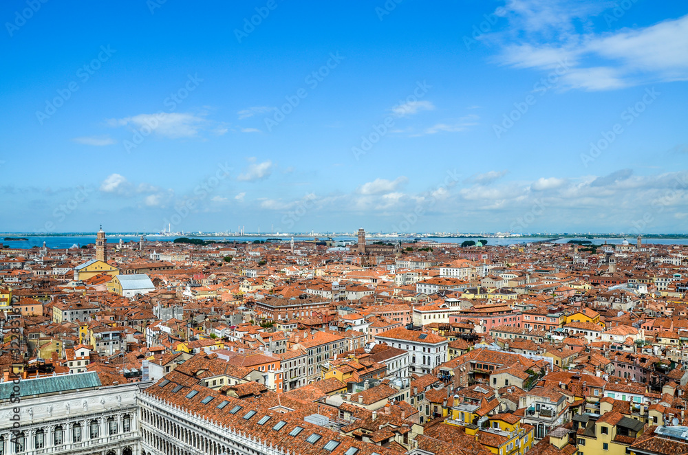 Aerial view of Venice taken from St. Mark`s Campanile in piazza San Marco of the many houses, buildings and roofs that make up Venice. Italy
