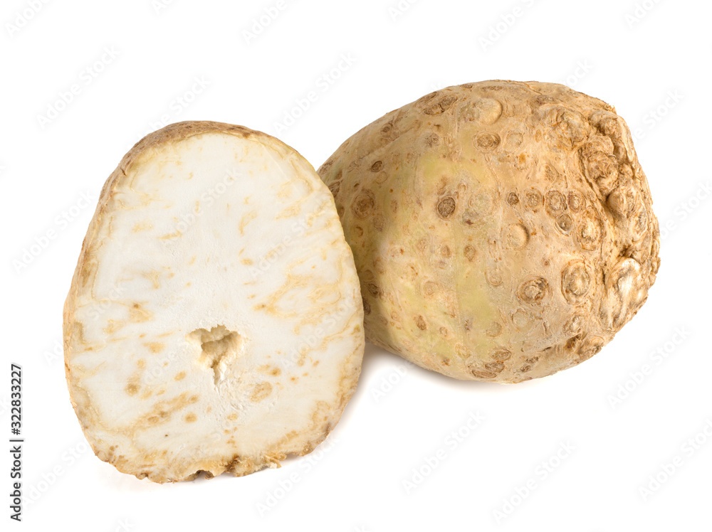 Celery root and its half isolated on a white background. Close-up. Celery root and its half isolated on a white background. Close-up.