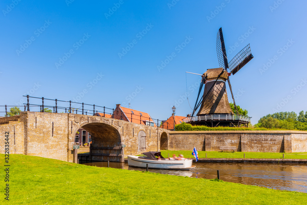 Recreational Boat sailing in Canal in Sloten Friesland Netherlands