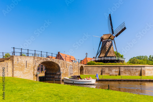 Obraz na płótnie Recreational Boat sailing in Canal in Sloten Friesland Netherlands w salonie