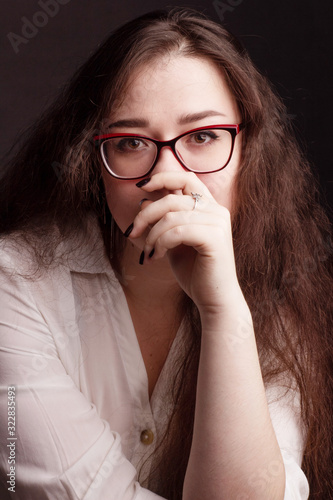 portrait of a plump brunette with long curly hair