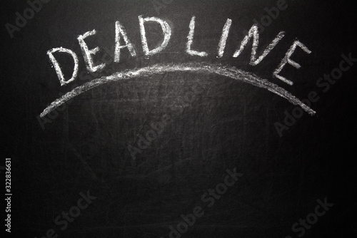 Deadline text on blackboard, business concept background