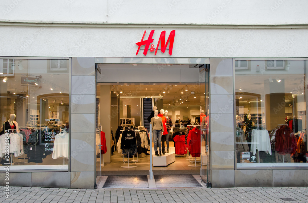 Soest, Germany - December 18, 2017: H&M sign on the wall. H&M Hennes &  Mauritz AB is a Swedish multinational clothing-retail company, clothing for  men, women, teenagers and children. Stock Photo | Adobe Stock