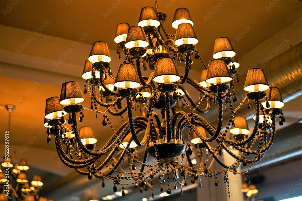 Beautiful chandelier shines in a beautiful ambience. Beautiful chandelier shines in a beautiful ambience.