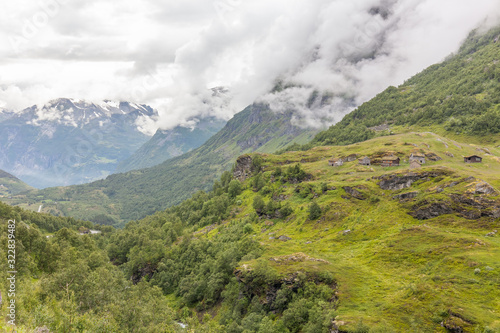 Old little houses with grass roofs. On the way to observation place in Dalsnibba mountain. Geiranger fjord Norway, selective focus