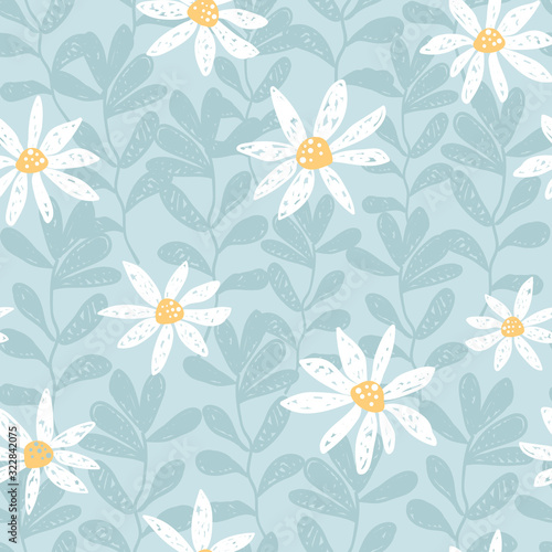 Hand drawn seamless vector pattern with chamomile flowers and leaves. White daisy on a blue background. Tender ditsy illustration perfect fo fabrics.