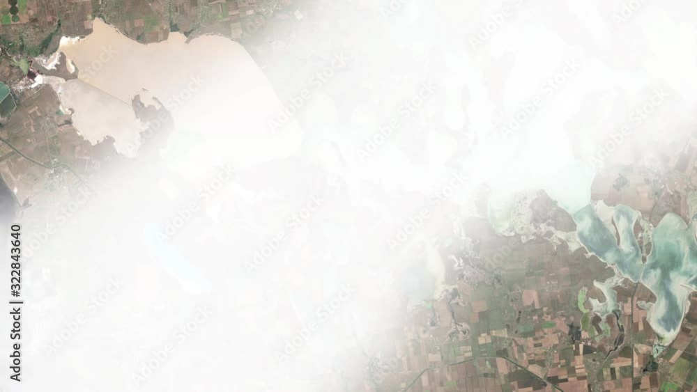 Network of hued lagoons Sivash area in Ukraine, aerial satellite view moving clouds animation. Images furnished by Nasa Network of hued lagoons Sivash area in Ukraine, aerial satellite view moving clouds animation. Images furnished by Nasa