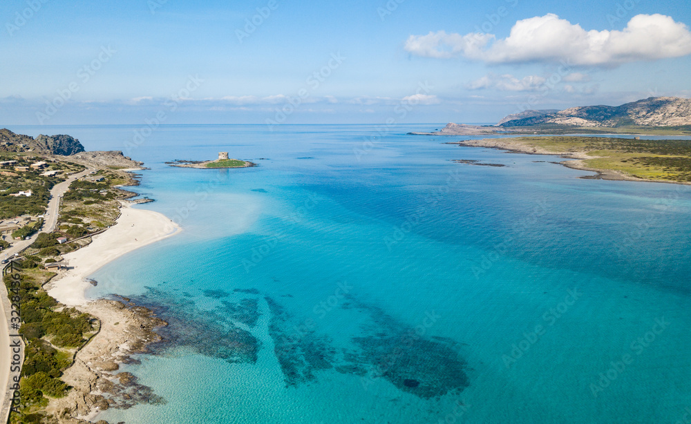 Aerial View of the Beautiful Stintino Beach With tower and The island of Asinara in Background Aerial View of the Beautiful Stintino Beach With tower and The island of Asinara in Background