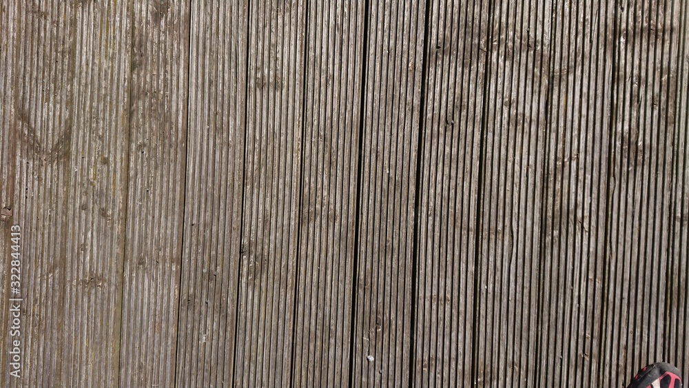 Weathered grey, wooden deck boards landscape vertical Weathered grey, wooden deck boards landscape vertical