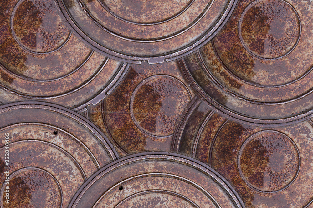Closeup photo of Old Sewer rust manhole abstract background. Rain scene