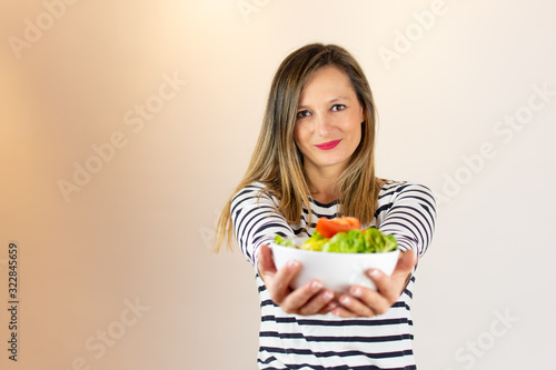 Woman with a salad in her hands