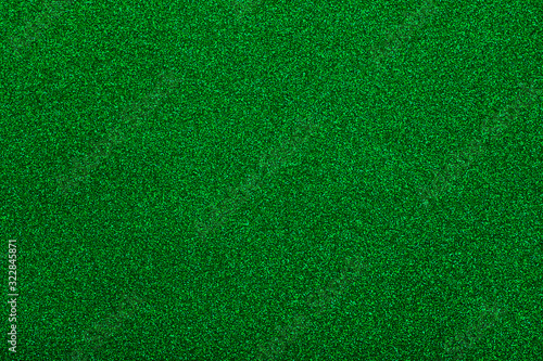 Sparkle of green glitter texture. Christmas background.