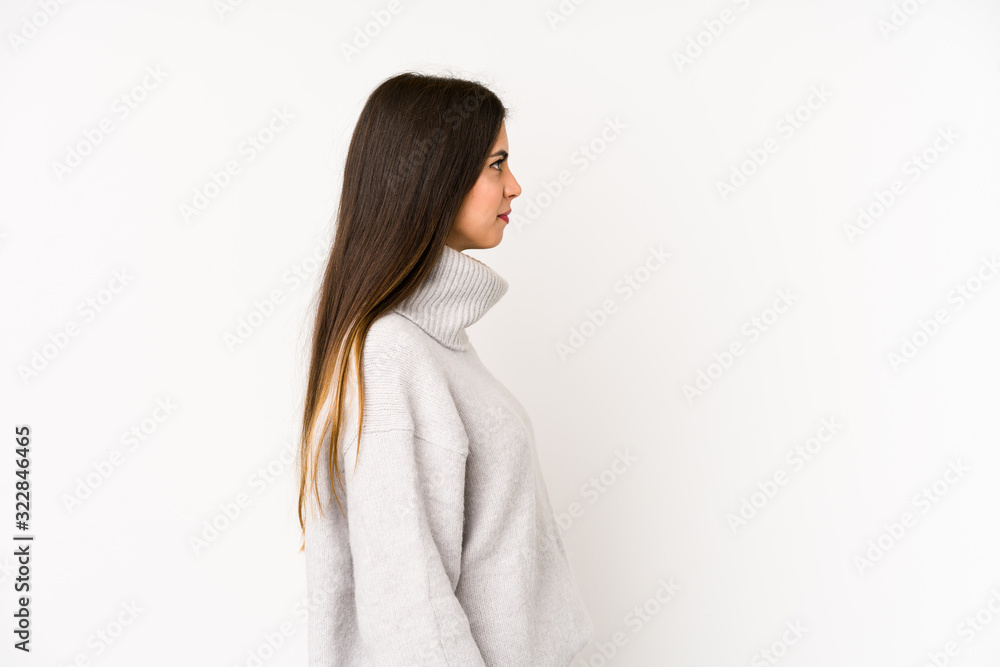 Young caucasian woman isolated on a white background gazing left, sideways pose. Young caucasian woman isolated on a white background gazing left, sideways pose.