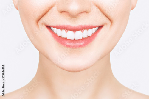 Perfect healthy teeth smile of a young woman. Teeth whitening. Dental clinic patient. Image symbolizes oral care dentistry, stomatology. Dentistry image.