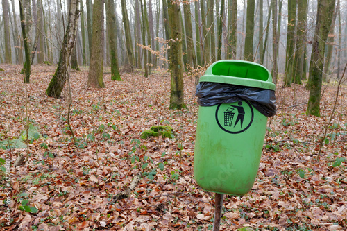 Trash bin in the forest. Autumn