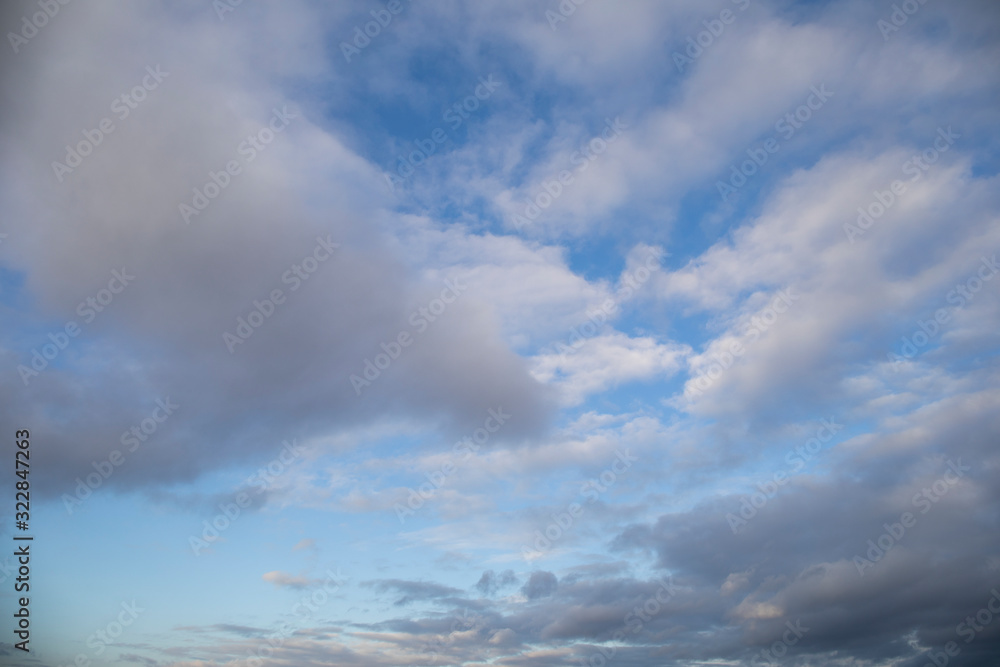 Moody evening sky in pink and grey shadows clouds