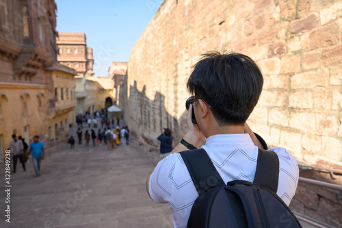 Explore india, Young man capturing photo in Mehrangarh Fort in Jodhpur city in Rajasthan, India